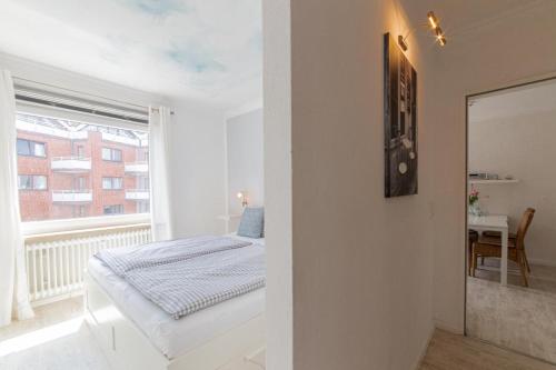 Postel nebo postele na pokoji v ubytování Ferienwohnung Strandkörbchen - Scharbeutz