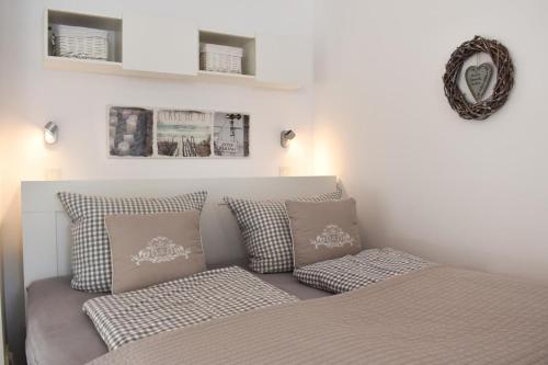 Postel nebo postele na pokoji v ubytování Ferienwohnung Sunshine Beachoase 106