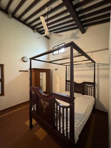Postel nebo postele na pokoji v ubytování Vittal Iyer House