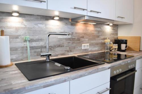 Kuchyň nebo kuchyňský kout v ubytování Ferienwohnung Meeresstrand