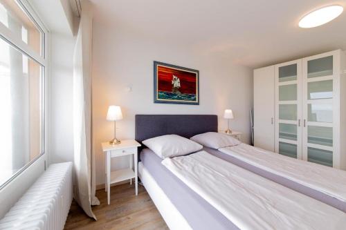 Postel nebo postele na pokoji v ubytování Ferienwohnung Muschelsucher