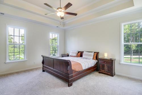 a bedroom with a bed and a ceiling fan at Savannah Lakes Village Home Golf and Hike! in McCormick