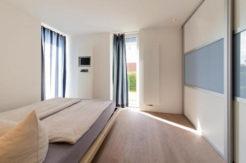 Lova arba lovos apgyvendinimo įstaigoje Ferienwohnung Zeitfenster Haffkrug