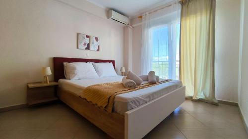 Ένα ή περισσότερα κρεβάτια σε δωμάτιο στο Michaela's apartment in Fanari