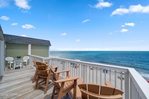 a balcony with chairs and a view of the ocean at Ocean Dunes 2112 in Kure Beach