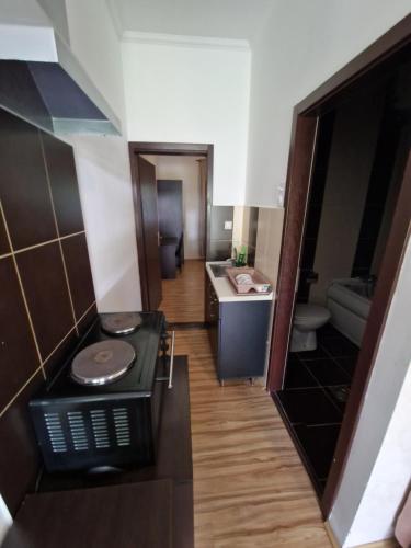 a small bathroom with a sink and a toilet at Stars Palić in Palić