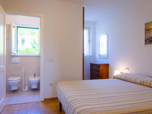 A bed or beds in a room at Residence Augusto