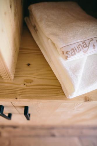 a book sitting on top of a wooden table at Gasthof Schönau in Moso