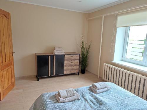 Giường trong phòng chung tại Two Bedroom apartment in city centre