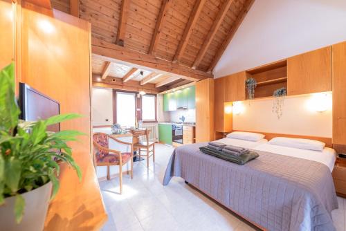 Ένα ή περισσότερα κρεβάτια σε δωμάτιο στο Comano Vacanze Appartamenti