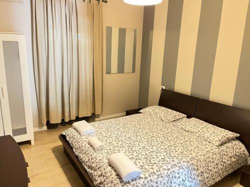 a bedroom with a bed with two towels on it at AFFITTACAMERE Self check-in Francesca Vecchia in Pontirolo Nuovo