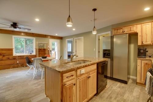 a kitchen with a sink and a counter top at Cozy Goode Cabin with Deck about 17 Mi to Lynchburg in Goode