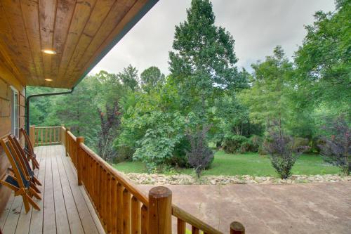 a deck with a view of a yard at Cozy Goode Cabin with Deck about 17 Mi to Lynchburg in Goode
