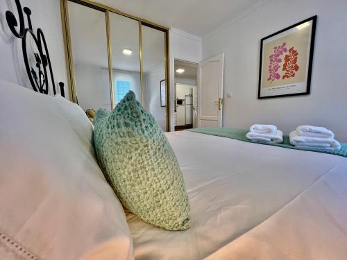 a bedroom with a bed with two pillows on it at Balnea Baiona in Baiona