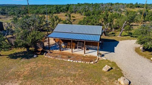 an overhead view of a house with a blue roof at Rockin' R - Rustic Star Cabin in Fredericksburg