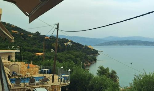 a view of a body of water from a building at Sofia Apartments in Barbati