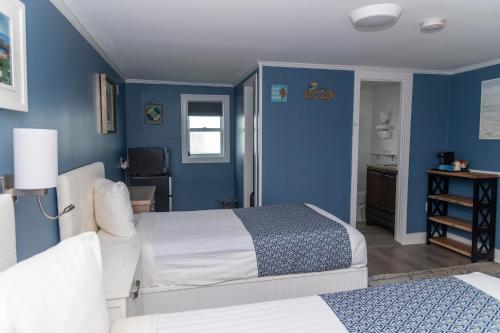 Ένα ή περισσότερα κρεβάτια σε δωμάτιο στο Sea Turn Motel