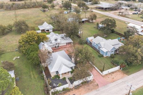 an aerial view of a large house with a yard at Stonewall Main Haus - Sleeps 6 in Stonewall