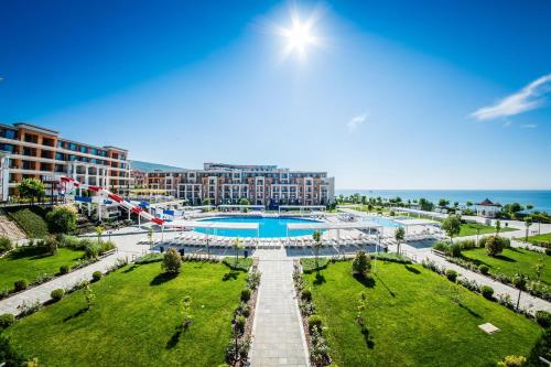 an aerial view of a resort with a swimming pool at Sea view Prestige Fort beach Apartment in Sveti Vlas