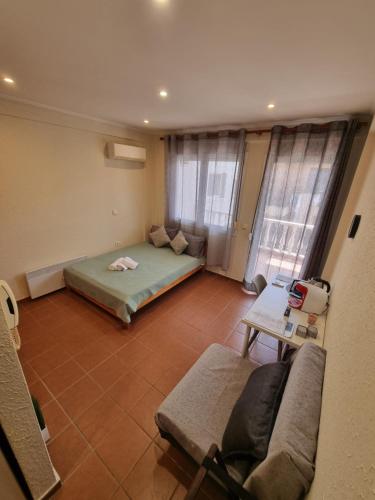 Postel nebo postele na pokoji v ubytování Astro Studio Apartments