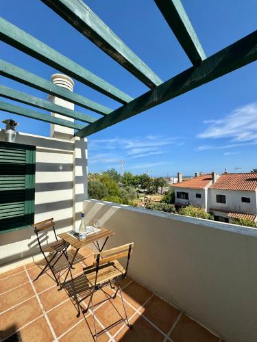 a patio with two chairs and a table on a balcony at Grupo Morgado - Quinta do Morgado - Morgado Privilege in Tavira