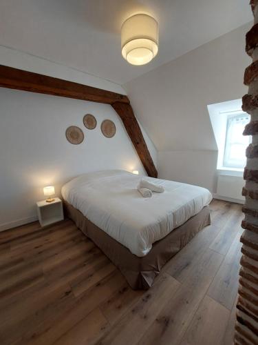 Katil atau katil-katil dalam bilik di Appartements L'hirondelle