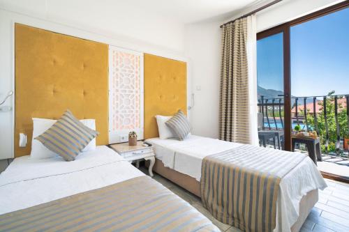 Ένα ή περισσότερα κρεβάτια σε δωμάτιο στο Ata Lagoon Beach Hotel