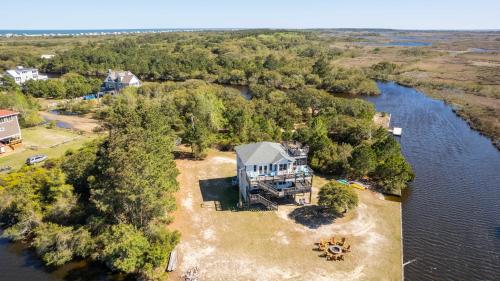 an aerial view of a house on an island in the water at Soundside, Canal Front! Water views!, 4x535, The 4x4 Leaf Clover in Knotts Island