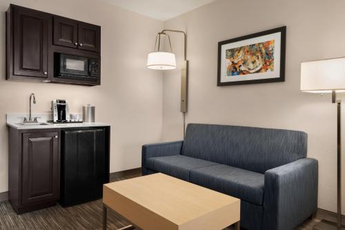 a living room with a couch and a table at Holiday Inn Express Hotel & Suites Mount Pleasant - Charleston by IHG in Charleston