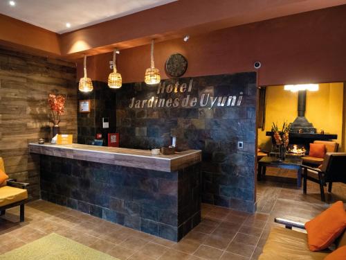 a hotel bar with a sign on the wall at Hotel Jardines de Uyuni in Uyuni