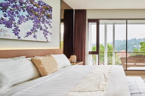 Ένα ή περισσότερα κρεβάτια σε δωμάτιο στο Kencana Villa 7 bedroom with a private pool