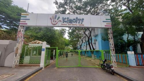 a gate with a motorcycle parked in front of a building at Vinh Hoi Apartments - Luxury Apartment Furnished Suites in Ho Chi Minh City
