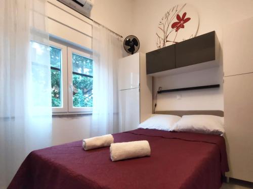 Postel nebo postele na pokoji v ubytování Rafael Apartments