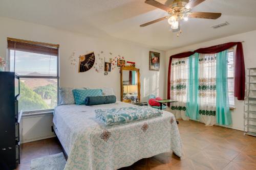 a bedroom with a bed and a large window at Charming McAllen Rental Home with Private Backyard! in McAllen