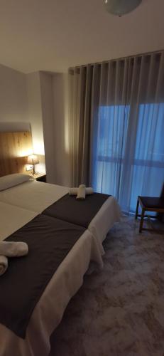 Ένα ή περισσότερα κρεβάτια σε δωμάτιο στο Hostal Santa Clara