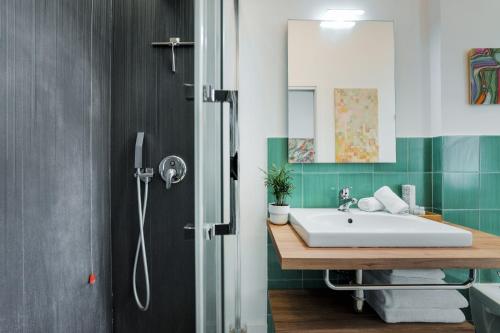 a bathroom with a sink and a shower at It's Room Naples in Naples