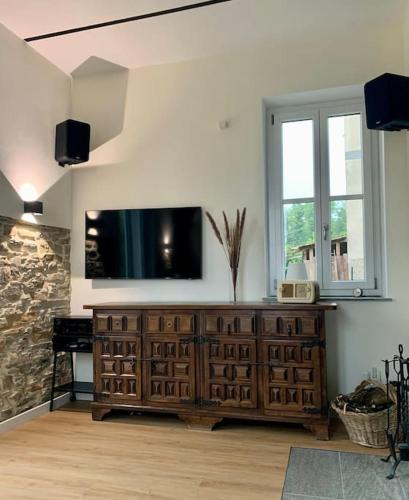 TV a/nebo společenská místnost v ubytování Ferienhaus Casa Toni mit Wallbox & Photovoltaik