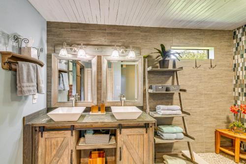 a bathroom with two sinks and a mirror at Waterfront Florida Vacation Rental with Boat Dock in Milton
