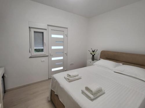 Ένα ή περισσότερα κρεβάτια σε δωμάτιο στο Room Natali