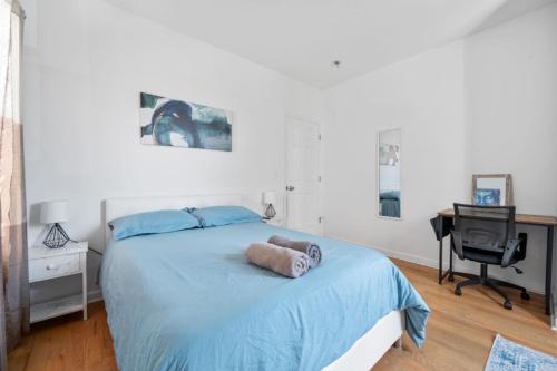 a bedroom with a bed with a stuffed animal on it at Modern Home 4BR 3BA - 20 Min to Timesquare in Jersey City