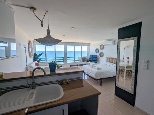 A bed or beds in a room at Loft Playa Muchavista
