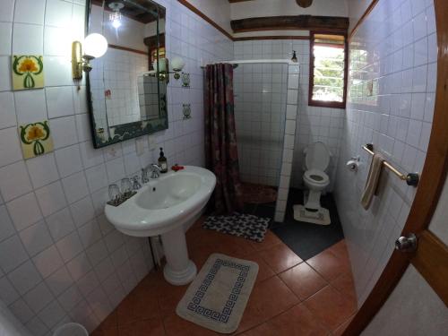 a bathroom with a sink and a toilet at PAPAGENO RESORT & DIVE in Kadavu
