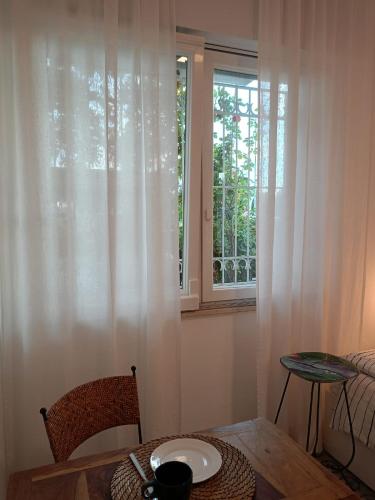 a small room with a table and a window at Bblueb&b in Rimini