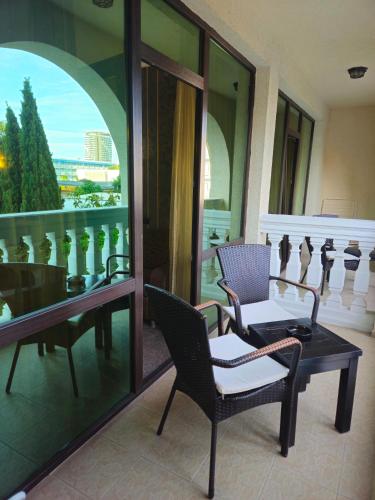 a room with two chairs and a table on a balcony at Art Hotel Babylon in Sunny Beach