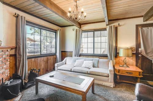a living room with a couch and a table at Near Lakes and Skiing Cozy Sugarloaf Cabin with Yard in Sugarloaf