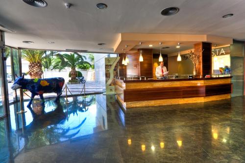a cow statue in the lobby of a hotel at BLUESEA Costa Serena in Torremolinos