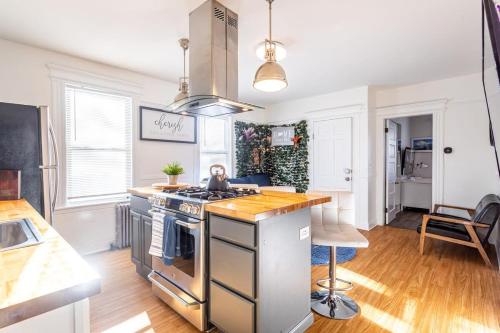 a kitchen with a stainless steel stove top oven at Spacious&Gracious- 5BR Fam-Friendly near I95&Shops in Fairfield