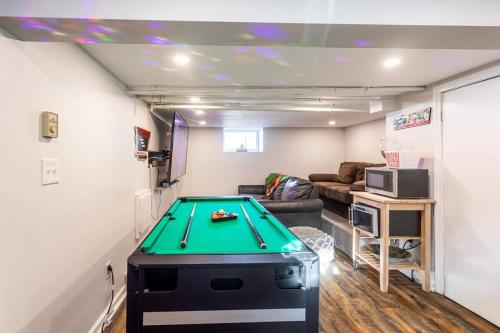a living room with a pool table in it at Spacious&Gracious- 5BR Fam-Friendly near I95&Shops in Fairfield