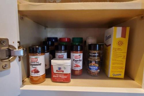 a drawer with spices and a box on a shelf at Spacious&Gracious- 5BR Fam-Friendly near I95&Shops in Fairfield