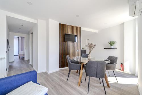 a dining room with a table and chairs at The Locomotive Flat by House and People in Braga